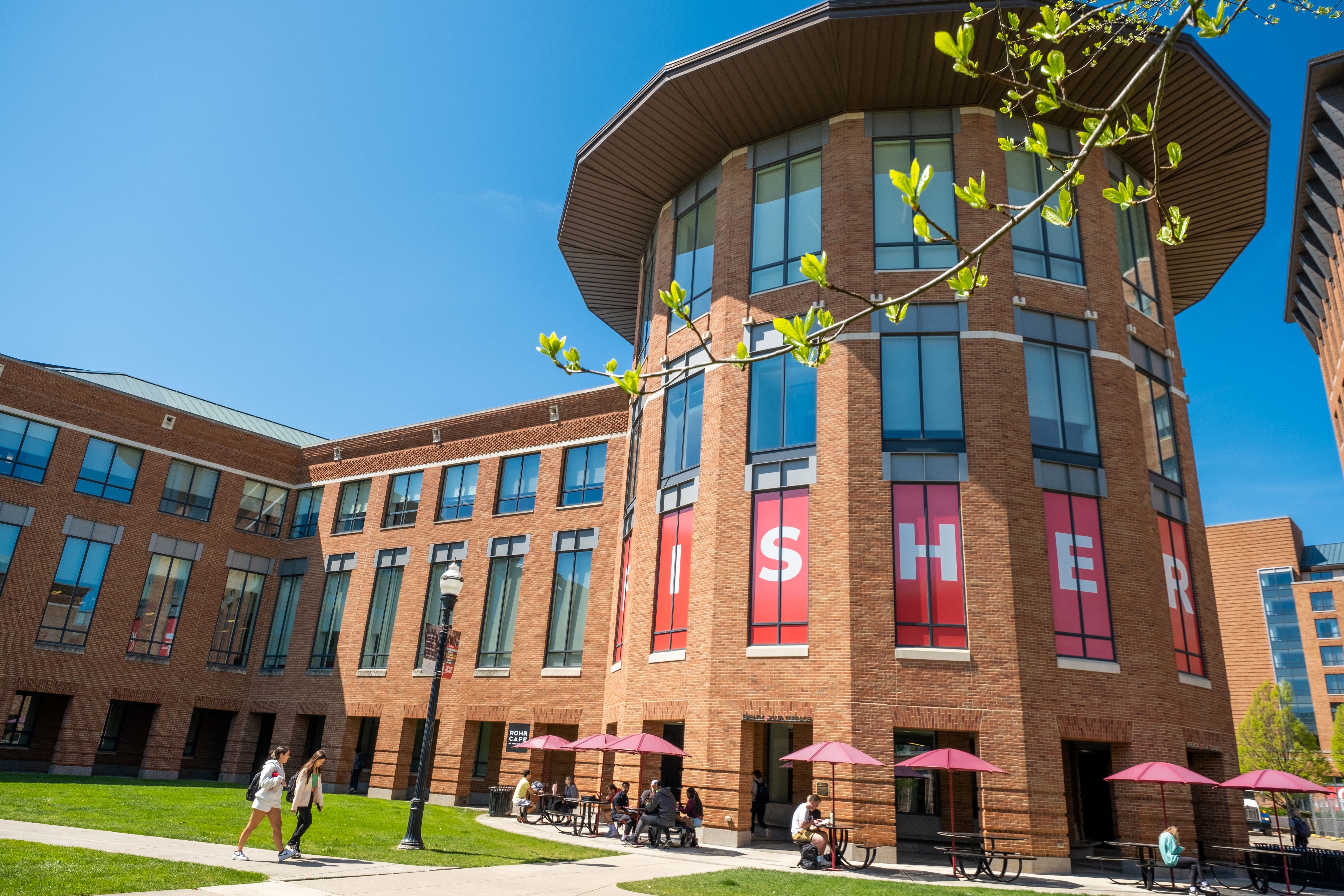 Students walking outside in front of Fisher College of Business